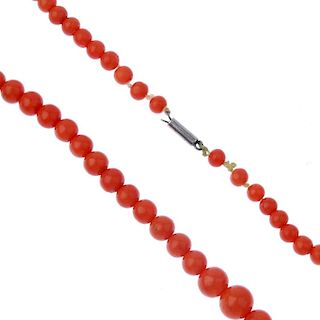 Two coral bead necklaces. Each designed as a series of graduated spherical coral beads measuring 0.3
