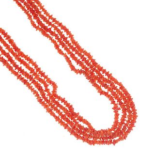 A selection of late 19th century and later coral jewellery. To include a four-row necklace, a coral