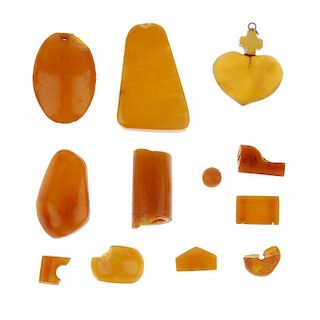 A selection of amber pieces. To include a selection of natural amber beads, a heart-shape pendant wi