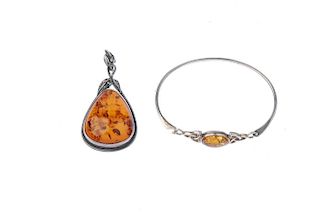 A selection of mainly silver and white metal set modified amber jewellery. To include a bangle with