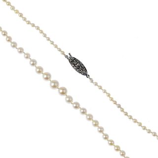 Two cultured pearl necklaces. Each designed as a single row of graduated pearls one with a marcasite
