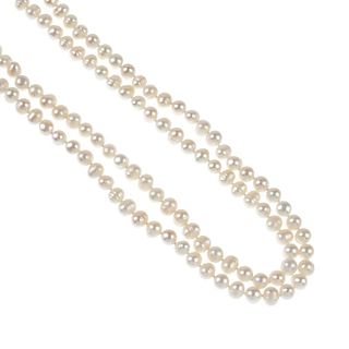 Two cultured pearl necklaces. The first a single strand of slightly irregularly shaped spherical cul