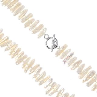 A selection of cultured pearl jewellery. To include a collar designed as a series of woven cultured