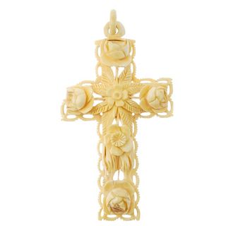 A late Victorian ivory cross pendant. Carved with openwork roses, leaves and branches, to the plain