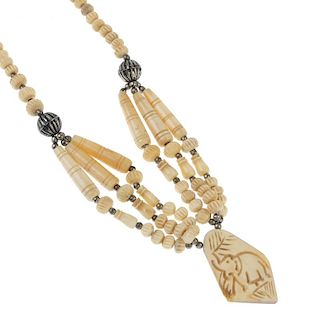 A large selection of bone jewellery. To include a beaded necklace, the bouton shape beads to the sev