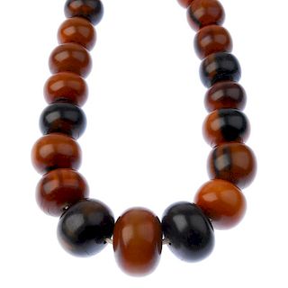 A large horn bead necklace. Comprising forty-four horn circular beads measuring 1.2 to 4.2cms., to t