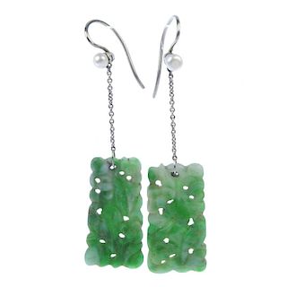 A pair of jade earrings. Each designed as a rectangular floral carved panel, suspended from a fine c
