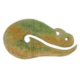 A New Zealand jade carved hei matau by Paddy Cooper. Representing a stylised fish hook and symbolisi