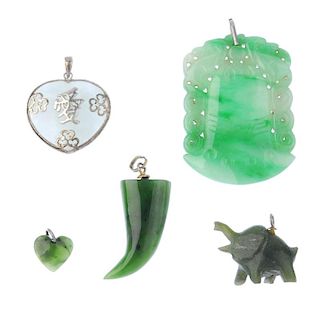 A selection of jade jewellery. To include a carved jade pendant, a jade bangle, a nephrite jade bead
