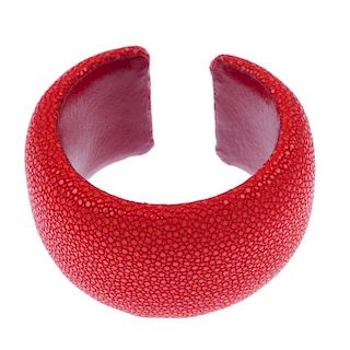 A red stingray cuff. The red stingray cuff with red leather lining signed Maximos. Inner diameter 5.