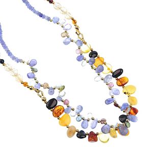 A tanzanite and multi-gem necklace and a natural and reconstructed amber and citrine necklace. The t