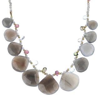 A sunstone necklace and a moonstone necklace. The first with small moonstone bouton-shape beads and