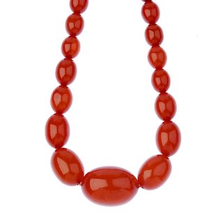 Three plastic bead necklaces. The first designed as a red plastic bead necklace, the flattened spher