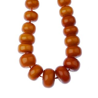 Two large plastic bead necklaces. The first designed as thirty-five graduated bouton-shape beads, th