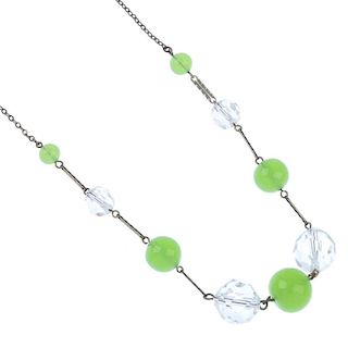 A rock crystal necklace and three paste necklaces. The rock crystal necklace designed as a series of