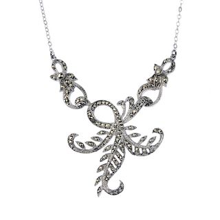 A selection of marcasite jewellery. To include a scrolling foliate necklace, an openwork bracelet, a