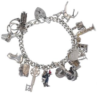 Six charm bracelets and a selection of loose charms. To include a rope-twist curb-link bracelet susp