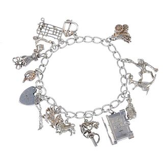 Three charm bracelets. The three curb-link chains suspending a total of thirty-one charms, to includ