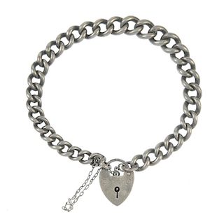 Five bracelets. Four of curb-link design with heart-shape padlock clasps, the fifth of double-curb l