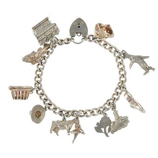 A selection of silver and white metal jewellery. To include a charm bracelet, the curb-link chain wi