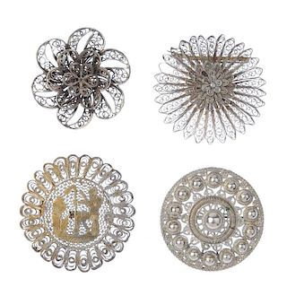 A selection of silver and white metal filigree jewellery. To include a brooch in the shape of two fe