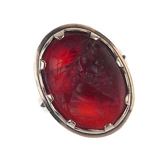 An intaglio ring. The oval-shape carnelian with intaglio depicting a man in profile wearing a hat, c
