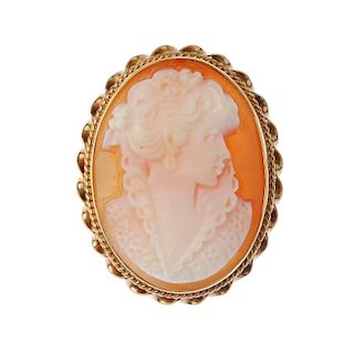 A bangle and a 9ct gold cameo brooch. The bangle with acanthus engraving, colourless and blue pastes
