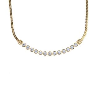 SWAROVSKI - a necklace. Designed as a flat curb-link chain to the thirteen collet-set colourless pas