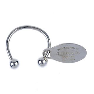 TIFFANY & CO. - a keyring. Of curved shape, the main keyring bar with removable terminal to one end
