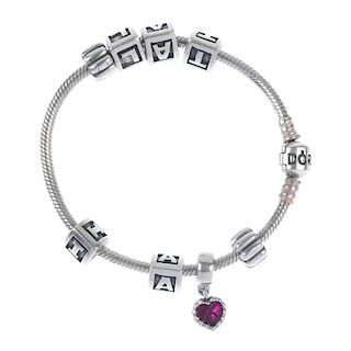 A Pandora charm bracelet and two Thomas Sabo charms. The Pandora bracelet, with five letter charms a