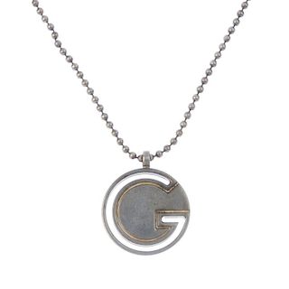 Four items of designer jewellery. To include a matching Gucci necklace and keychain, both with ball-