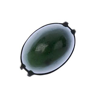 ANDREAS MIKKELSEN - a ring. Designed as an oval-shape nephrite jade cabochon, collet-set to the doub