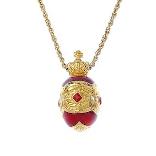 JOAN RIVERS - a pendant and chain. Designed as a red enamel egg with central red and colourless past