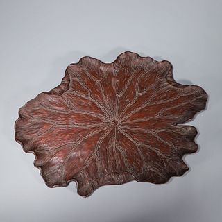 A lotus leaf-shaped wood pedestal