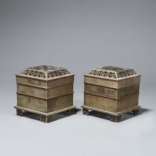 A pair of copper incense burners