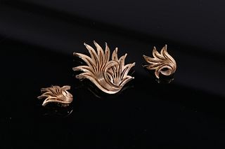 A set of Trifari frosted gold ear clips and brooch