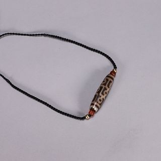 An agate nine-eyed dzi bead pendant