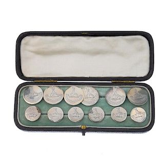 A set of twelve Edwardian silver buttons. Each of circular-shape, engraved to depict a bird, with mo