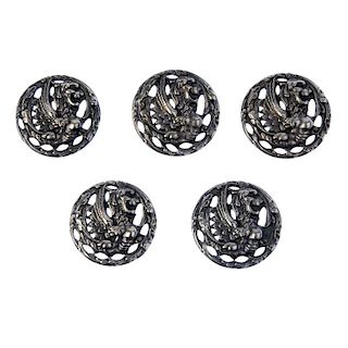 Four sets of early 20th century silver buttons. The first, a set of six designed as an openwork circ