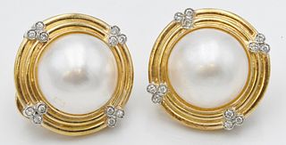 Pair of 14 Karat Gold Round Earrings, having round pearls and small diamonds, 14.4 millimeter pearls, 16.9 grams total weight.