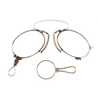 A pair of late 19th century 9ct gold pince-nez and a small 9ct gold magnifying glass. Lengths 8.5 an