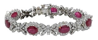 18 Karat White Gold Ladies Designer Style Ruby and Diamond Bracelet, having seven oval shaped rubies consisting of 17.15 carats and 9.46 carats of rou
