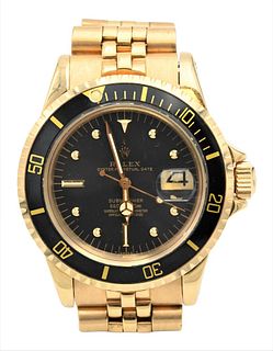 Rolex Submariner 18 Karat Gold Wristwatch, having Jubilee band along with original 1980 warranty paper, 40 millimeter, #5860623, having brown leather 