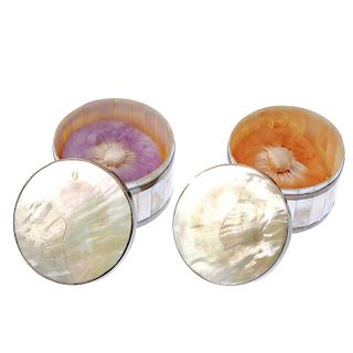 Two mother-of-pearl powder puff pots. Designed as circular outlines, with panelled mother of pearl s