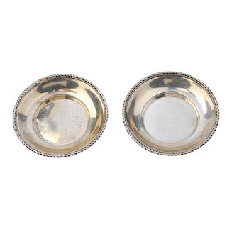 ASPREY - a pair of 1920s silver pin trays. Each designed as a plain dish, with rope-twist outline. M