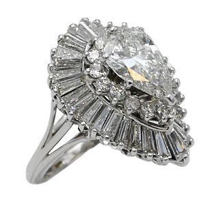 14 Karat White Gold and Diamond Ring, set with 1.65 carat center diamond, surrounded by round diamonds, surrounded by baguette diamonds, 8.3 grams.
