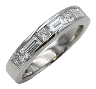 Platinum Ring, set with four princess cut and three baguette diamonds, size 5 1/2, 6.6 grams.
