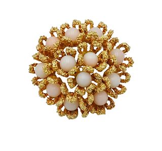 18 Karat Gold Brooch, set with pink coral, diameter 1 1/4 inches, 16.8 grams.