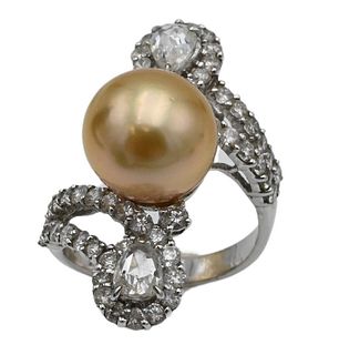 18 Karat White Gold Ring, set with golden colored pearl having two pear shaped diamonds, along with round cut diamonds, size 6, 7.9 grams.