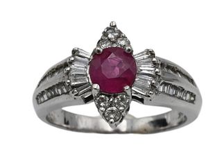 14 Karat White Gold Ring, set with center round ruby surrounded by round and baguette diamonds, size 7, 5.1 grams.